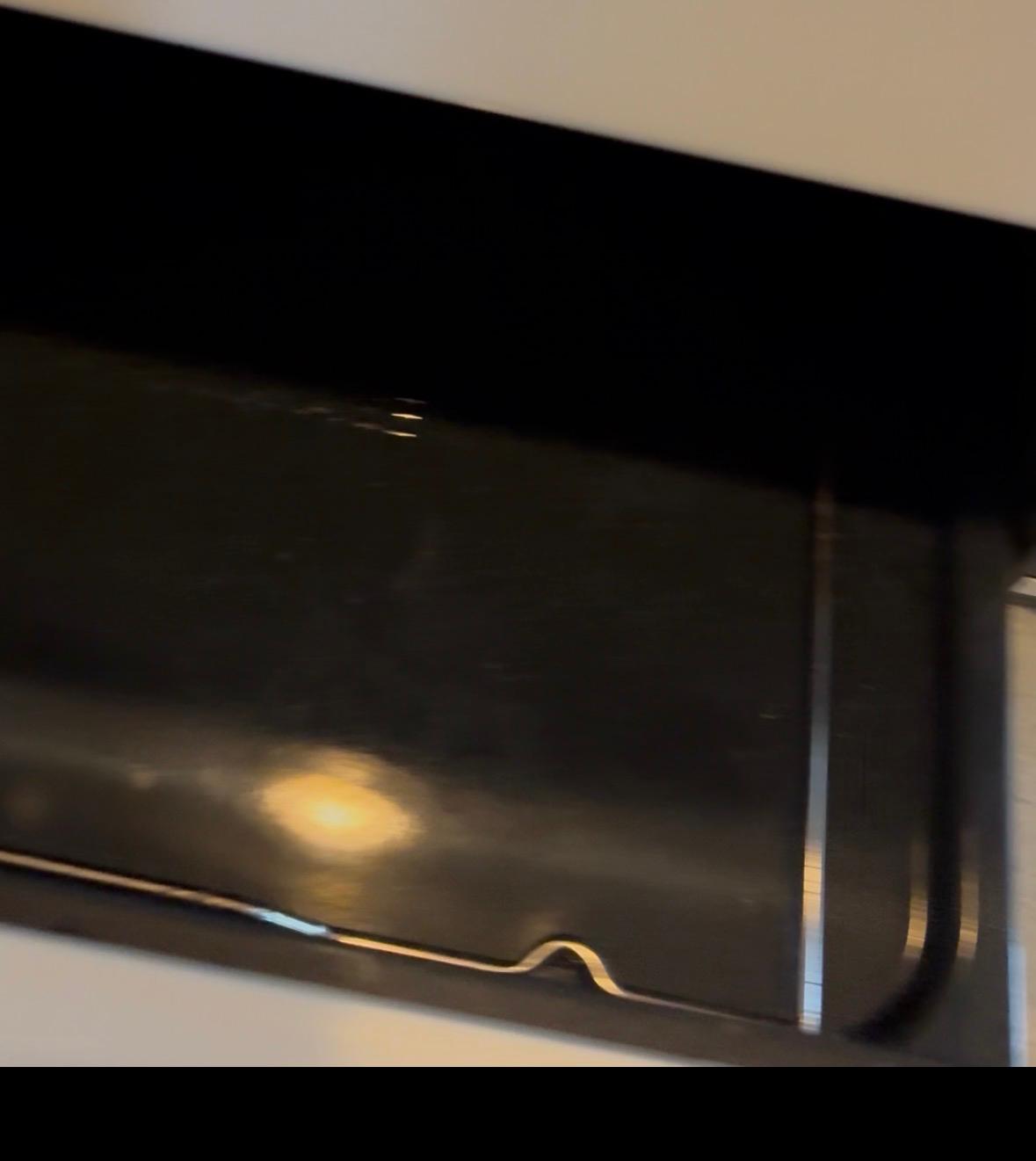 The same oven door clean and shining after a deep cleaning